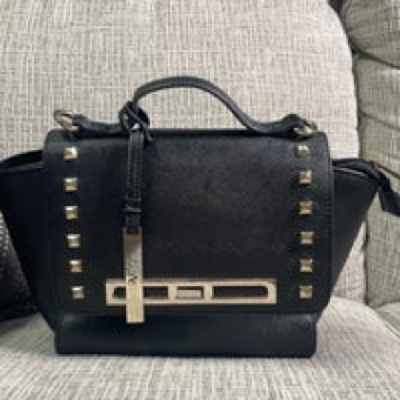 ALESSANDRO Versace 1969 bag. Alessandro Versace is a designer in his own  right.